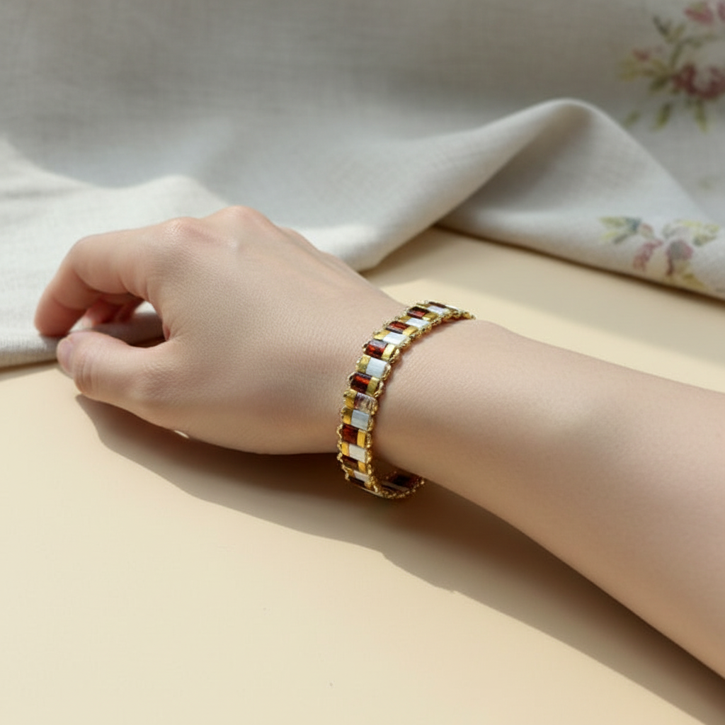 Red Picasso and Gold Bracelet on Wrist